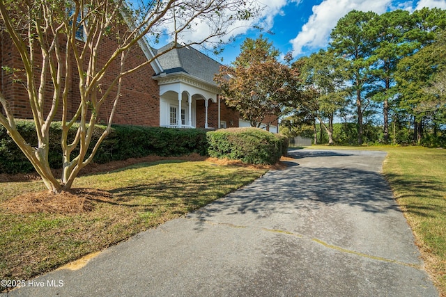 view of home's exterior with a yard