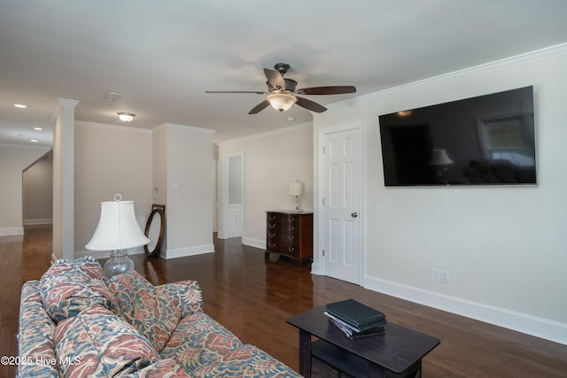 living room featuring dark hardwood / wood-style flooring, crown molding, and ceiling fan