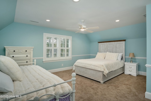 bedroom featuring vaulted ceiling, light carpet, and ceiling fan