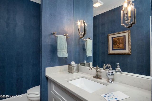 bathroom with vanity and toilet