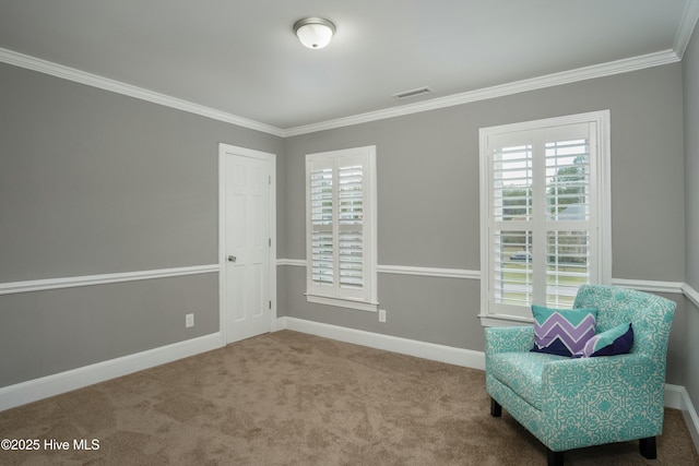 living area featuring crown molding and carpet