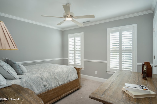 bedroom featuring ceiling fan, ornamental molding, and light carpet