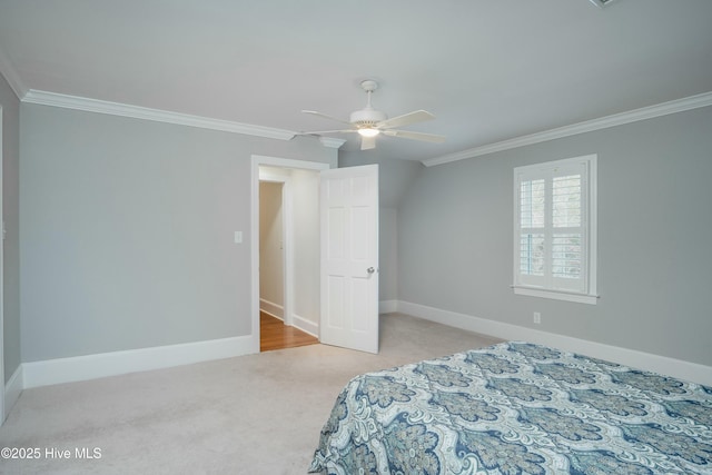 carpeted bedroom featuring ceiling fan and ornamental molding