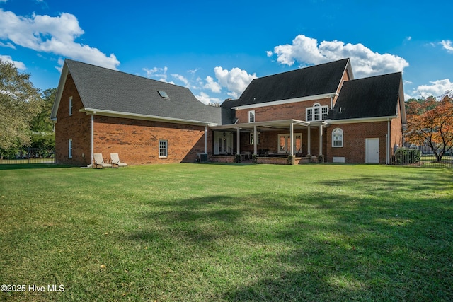 back of house featuring a yard