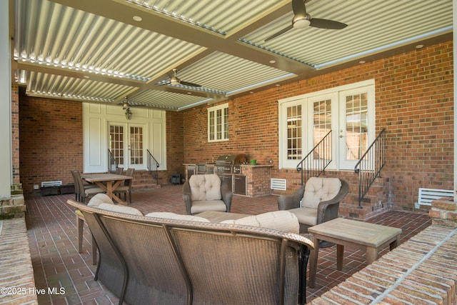 view of patio / terrace with french doors, ceiling fan, exterior kitchen, and area for grilling