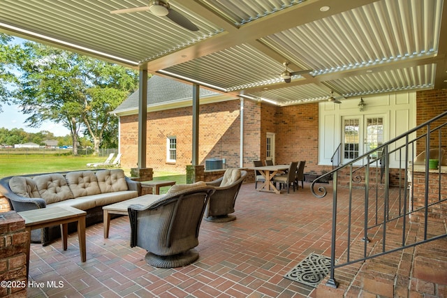 view of patio / terrace with cooling unit, a pergola, outdoor lounge area, and ceiling fan