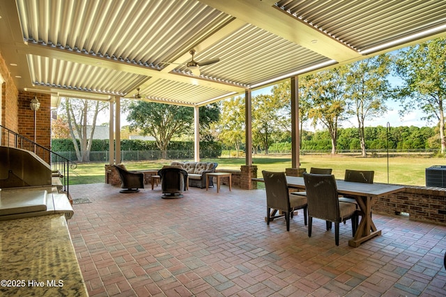 view of patio / terrace featuring area for grilling, an outdoor living space, central AC, and ceiling fan