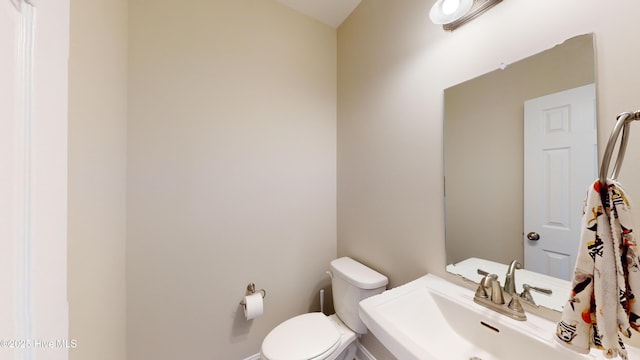 bathroom with a sink and toilet