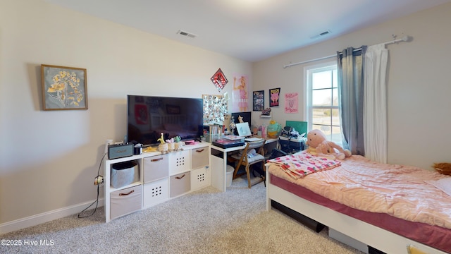 bedroom featuring baseboards, visible vents, and carpet