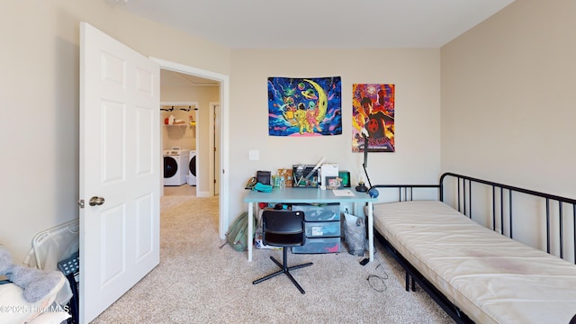 carpeted bedroom featuring washing machine and dryer