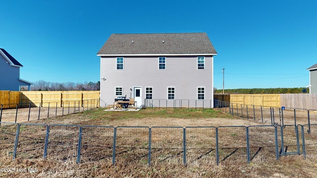 back of house with a patio