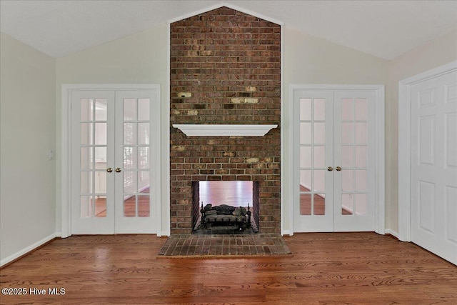 6 Elmhurst Pl, Pinehurst, NC 28374 - unfurnished living room featuring french doors, lofted ceiling, and wood finished floors
