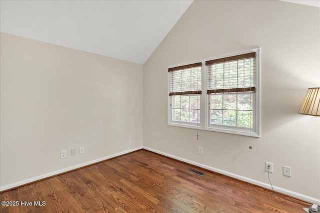 6 Elmhurst Pl, Pinehurst, NC 28374 - empty room with wood finished floors and vaulted ceiling