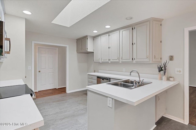 6 Elmhurst Pl, Pinehurst, NC 28374 - kitchen featuring a peninsula, recessed lighting, light countertops, light wood finished floors, and stainless steel dishwasher