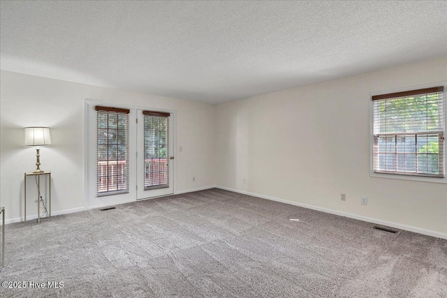 6 Elmhurst Pl, Pinehurst, NC 28374 - unfurnished room featuring a textured ceiling and carpet