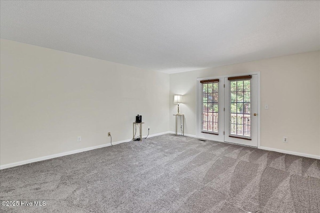6 Elmhurst Pl, Pinehurst, NC 28374 - spare room featuring carpet and a textured ceiling