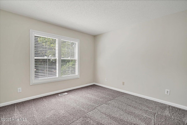 6 Elmhurst Pl, Pinehurst, NC 28374 - spare room featuring carpet flooring and a textured ceiling