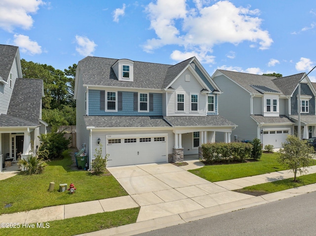 view of front of house with a garage and a front lawn