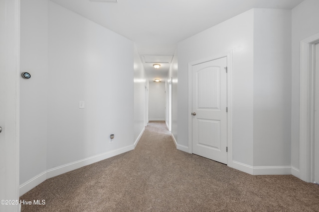 hall featuring light colored carpet