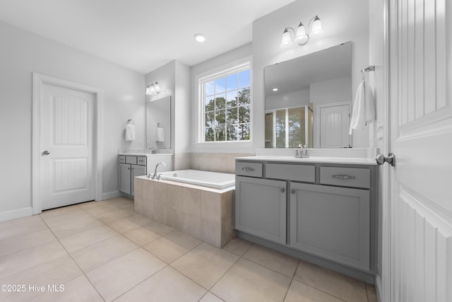 bathroom featuring vanity, tile patterned floors, and plus walk in shower