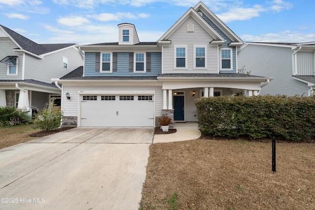 view of front of home featuring a garage and a front yard