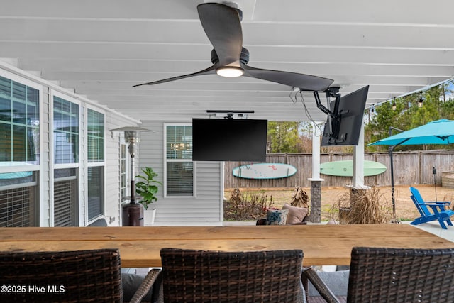 wooden terrace featuring ceiling fan