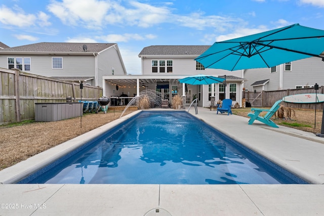 view of pool featuring grilling area, a patio, and ceiling fan