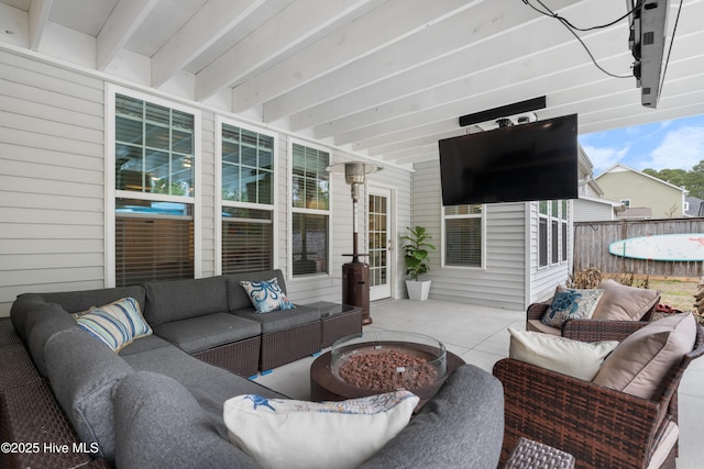 view of patio featuring an outdoor living space with a fire pit