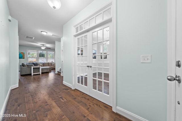 hallway with french doors and dark hardwood / wood-style floors