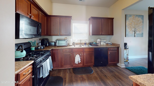 kitchen featuring dark hardwood / wood-style flooring, sink, and black appliances