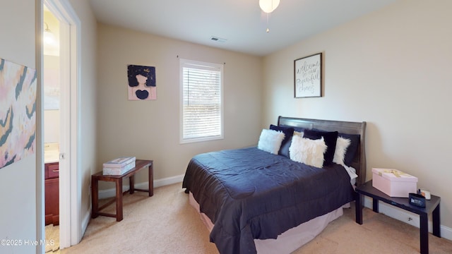 carpeted bedroom featuring ensuite bathroom