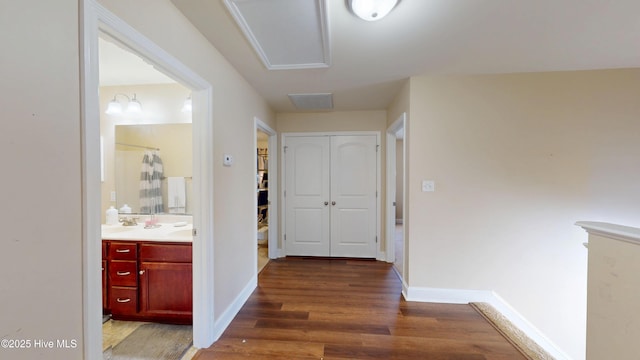 corridor featuring dark hardwood / wood-style flooring