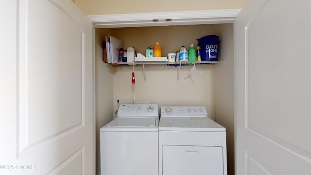 washroom with washing machine and dryer