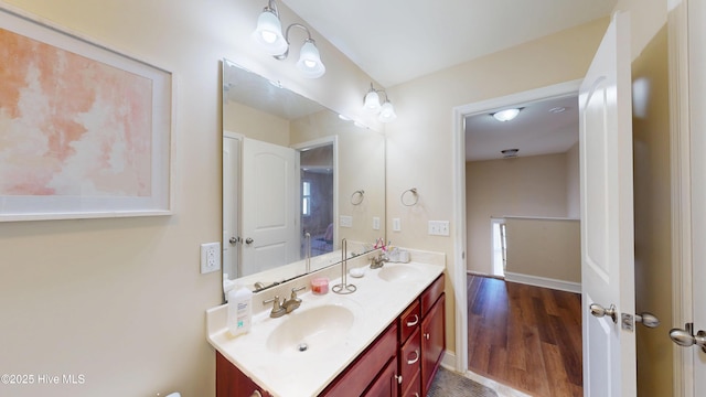 bathroom featuring hardwood / wood-style floors and vanity