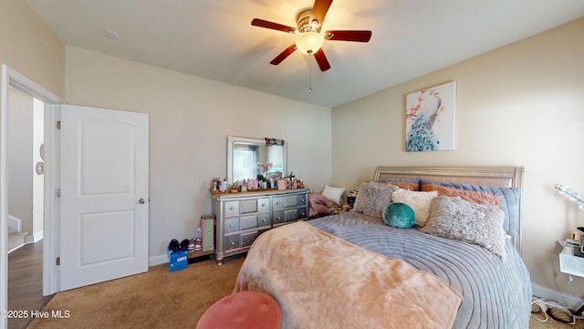 carpeted bedroom featuring ceiling fan