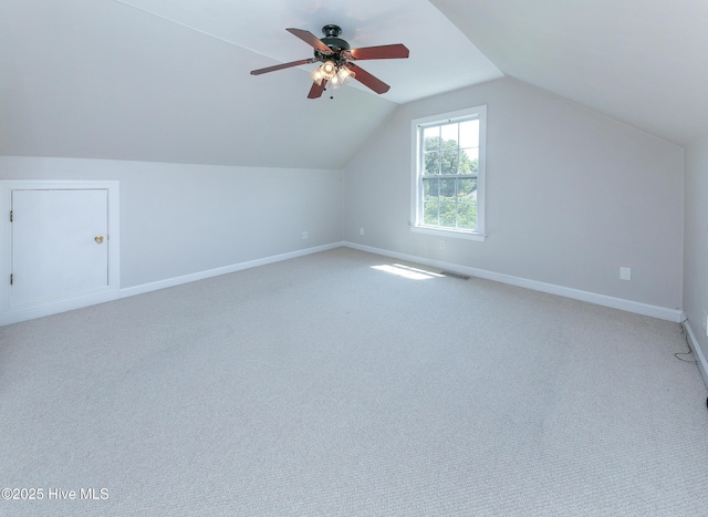 bonus room with ceiling fan, vaulted ceiling, and carpet