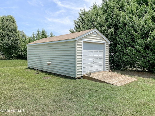 garage featuring a yard