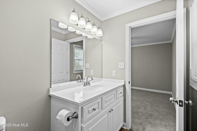 bathroom with vanity, baseboards, and ornamental molding