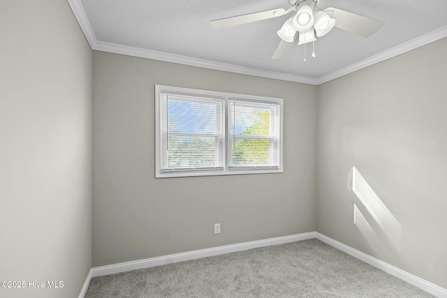 unfurnished room featuring ornamental molding, carpet floors, and baseboards