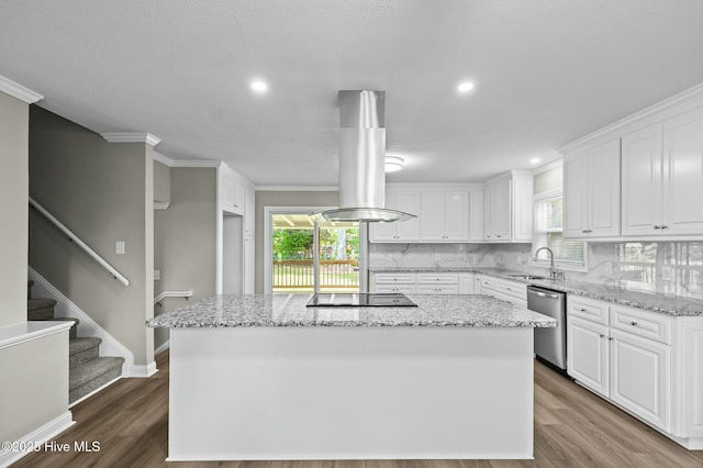 kitchen featuring black electric stovetop, stainless steel dishwasher, a center island, white cabinets, and island range hood