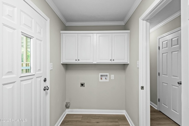 laundry room with dark wood finished floors, hookup for a washing machine, electric dryer hookup, ornamental molding, and baseboards