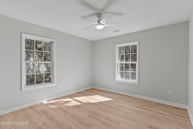 unfurnished room featuring ceiling fan and light wood-type flooring