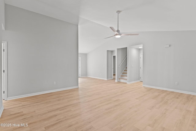 unfurnished living room featuring vaulted ceiling, ceiling fan, and light hardwood / wood-style floors