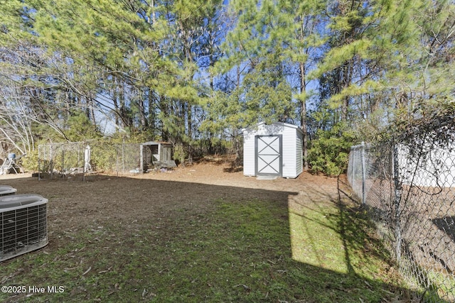 view of yard featuring central AC and a shed