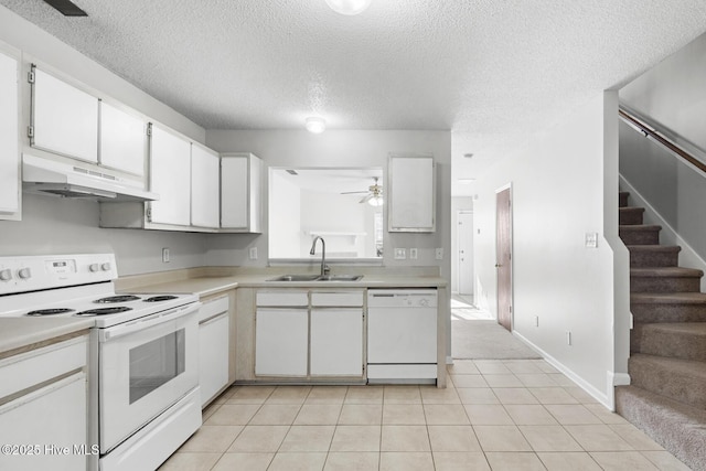 kitchen with white cabinetry, sink, light tile patterned floors, ceiling fan, and white appliances