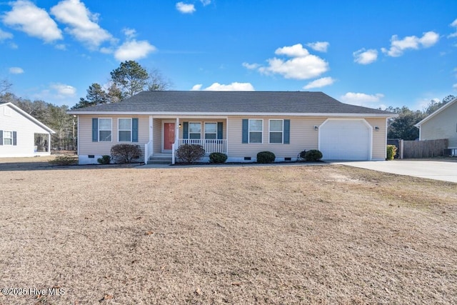 ranch-style house featuring a garage and covered porch