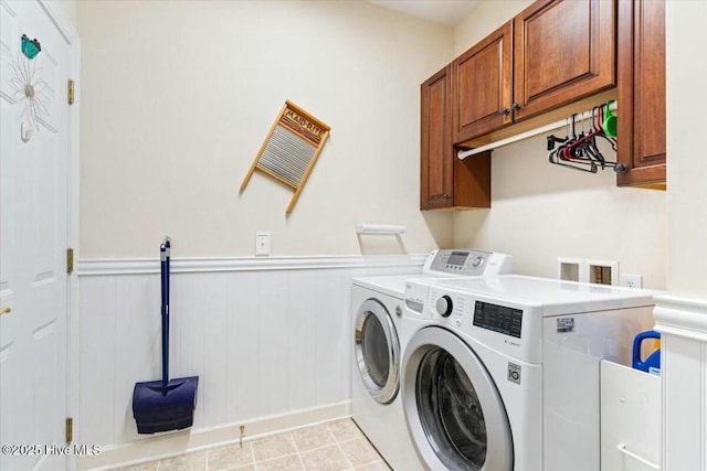 laundry area with cabinets, light tile patterned floors, and independent washer and dryer