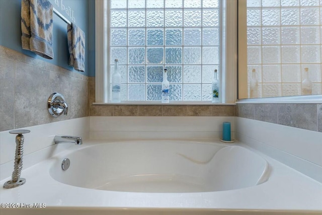 bathroom featuring a washtub