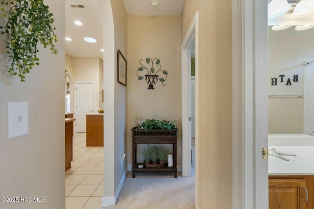 hallway with light tile patterned floors