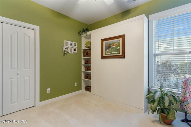 interior space featuring light colored carpet